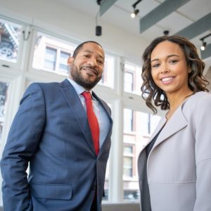 man-and-woman-smiling-inside-building-1367269